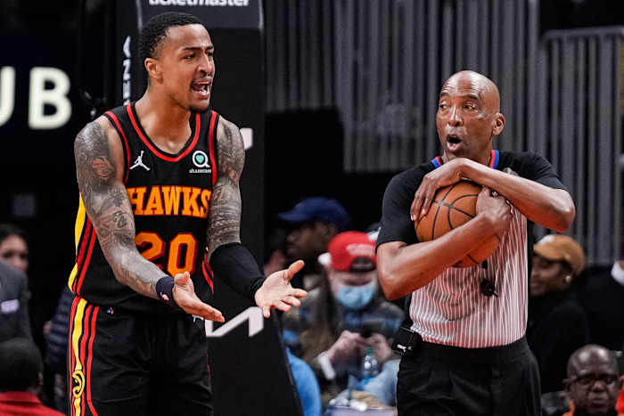 John Collins argues with an official.